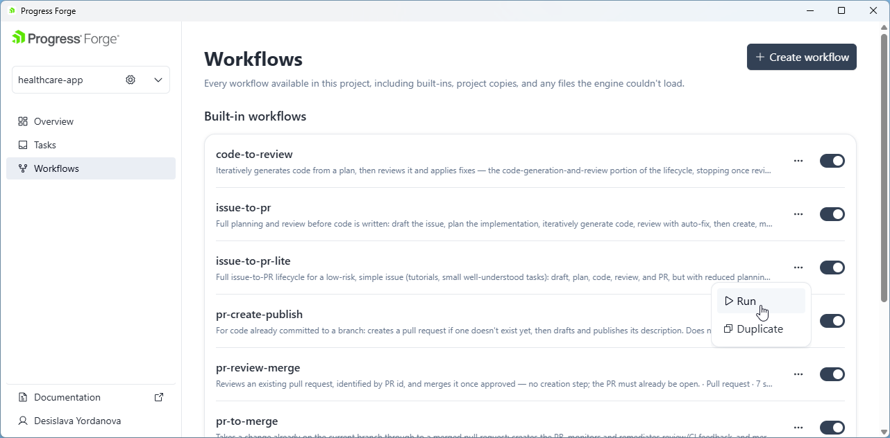 Workflows page showing built-in workflows, per-workflow toggles, and a row menu with Run and Duplicate actions.