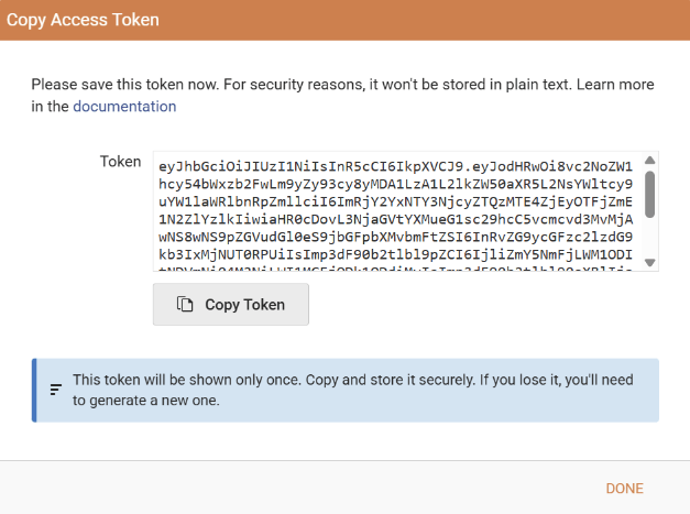 The form letting the user copy the newly created personal access token with the warning that the token should be stored securely as it will be shown only once.