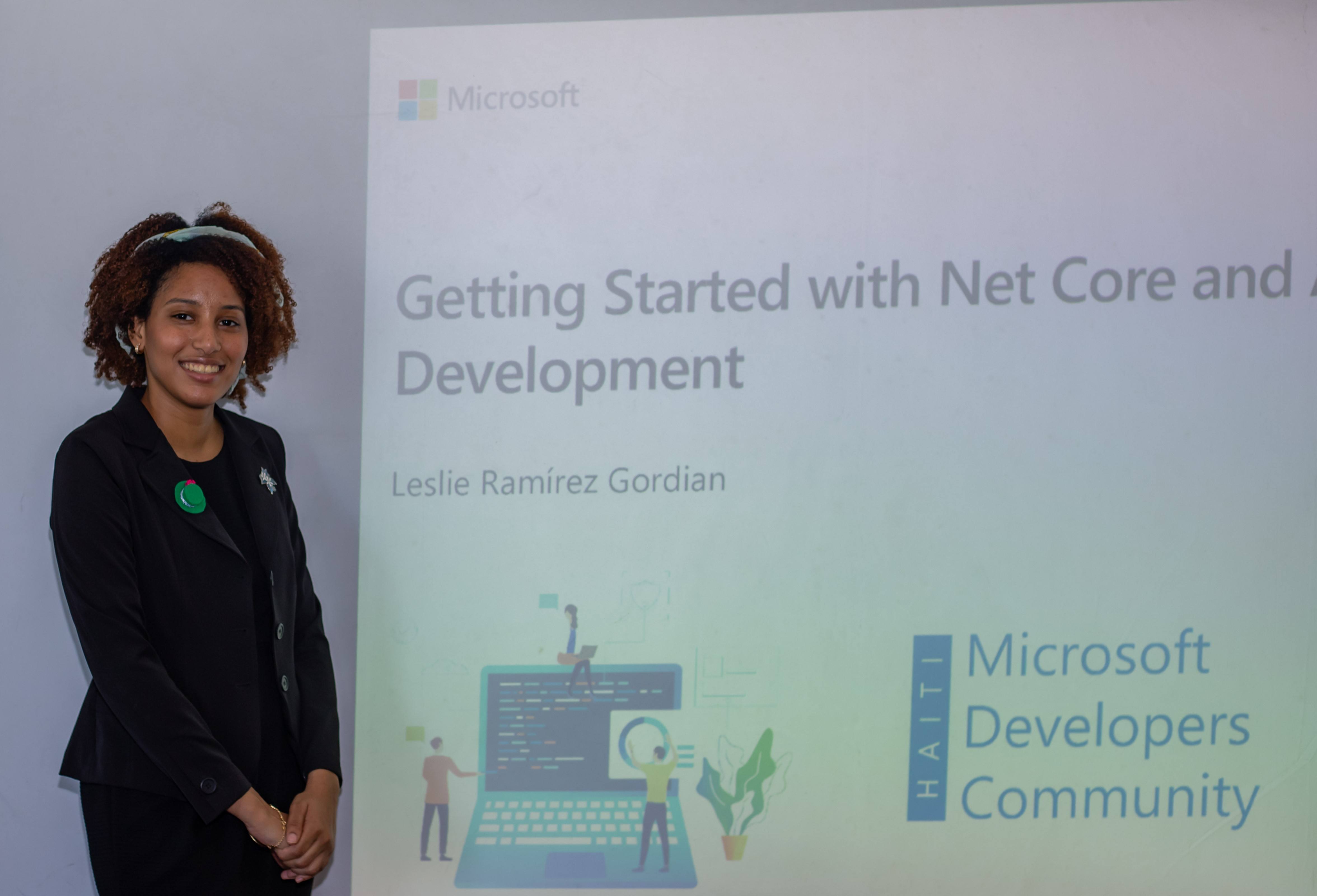 Leslie Ramirez Leslie Ramirez in front of a slideshow with 'Getting Started with .NET Core...' Microsoft Developers Community Haiti