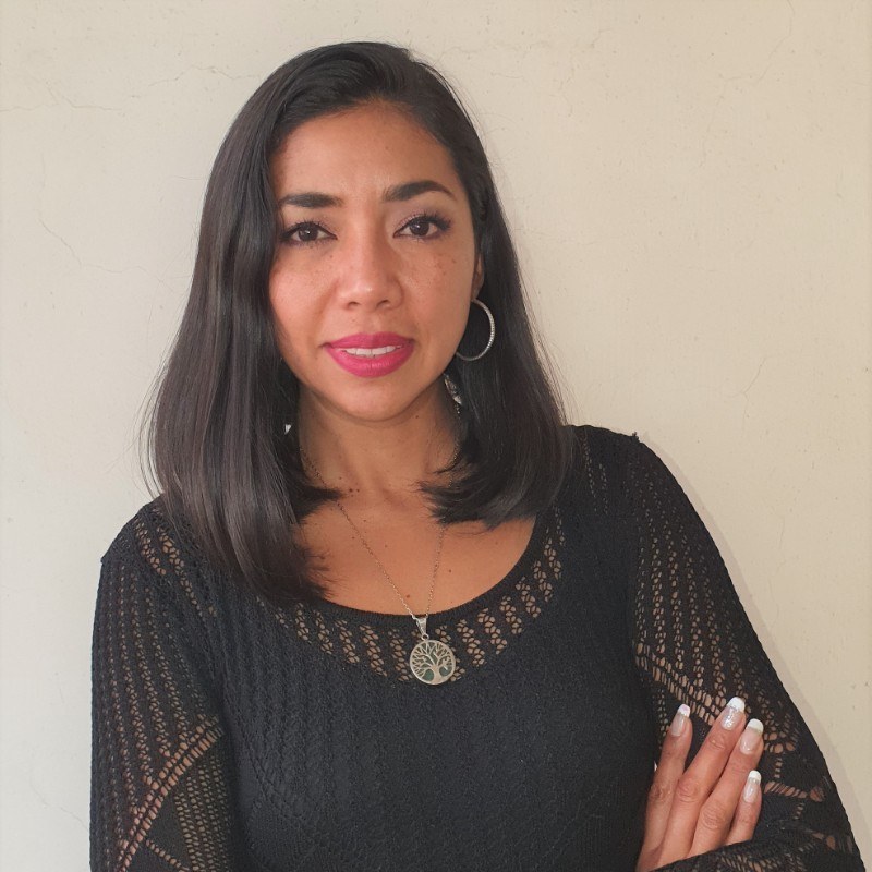 Fatima Blancas Fatima Blancas stands with arms crossed, smiling slightly