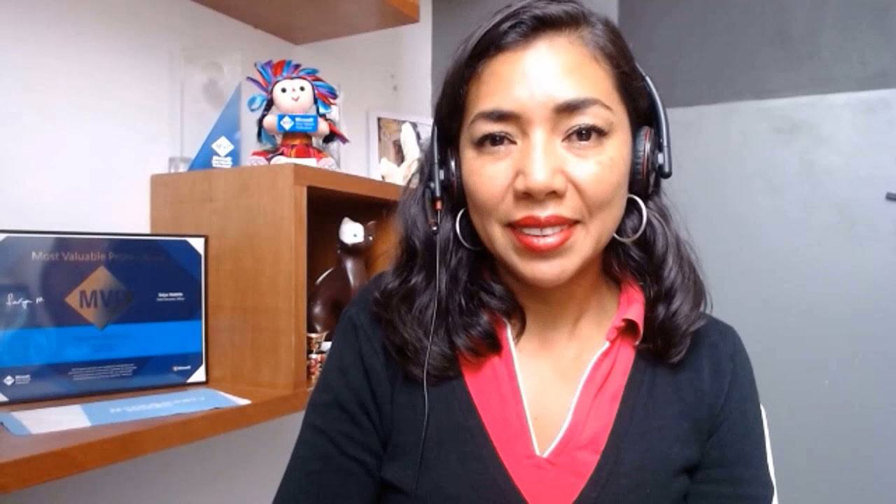 Fatima Blancas Fatima Blancas sitting by her MVP award while wearing headphones