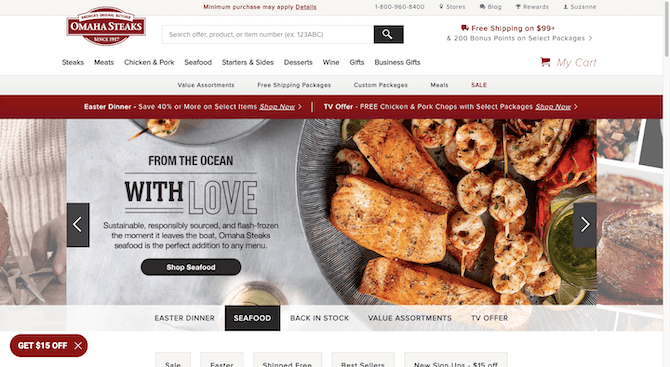 Omaha Steaks home page The home page for the Omaha Steaks website has a larger hero slider on it. The image we see here shows off a mixture of seafood — salmon filets, skewered shrimp, and lobster tails. The text reads: “From the ocean with Love. Sustainable, responsibly sources, and flash-frozen the moment it leaves the boat, Omaha Steaks seafood is the perfect addition to any menu”. There’s a black button beneath that reads “Shops Seafood”.