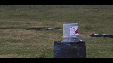 Bucket of red paint exploding