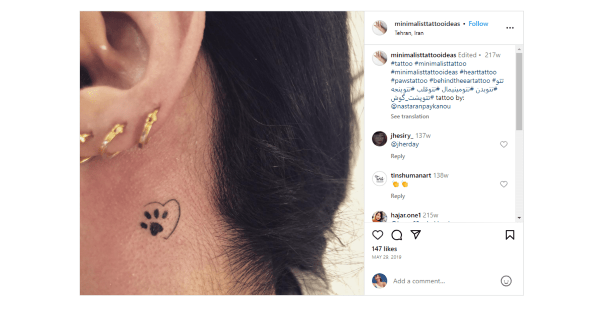 Minimalist Tattoo Ideas - paw print The @minimalisttattooideas page on Instagram shared this tattoo from @nastaranpaykanou. It’s a dog’s paw print inside a partial heart.