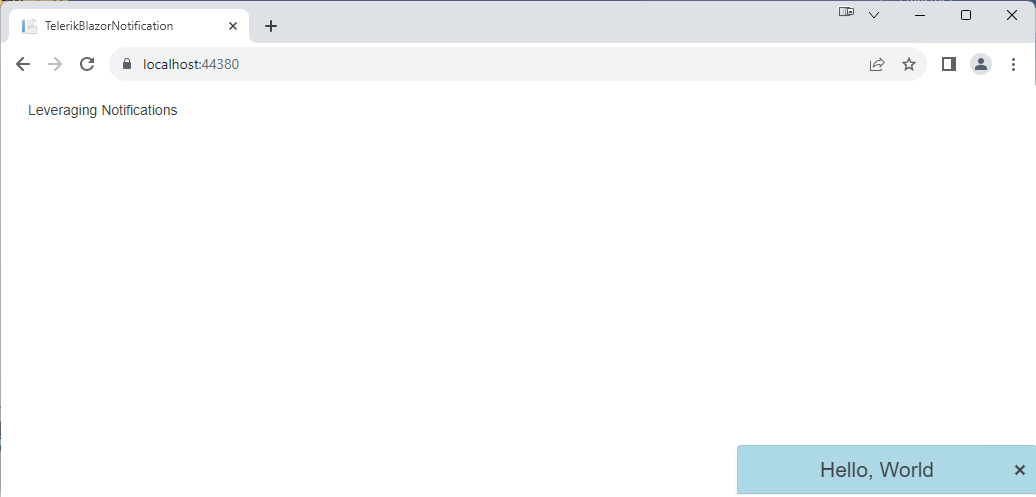 The web page as before but in the lower right corner is a box with a light-blue background and rounded corners with “Hello, World” in a text size large enough to be noticed.