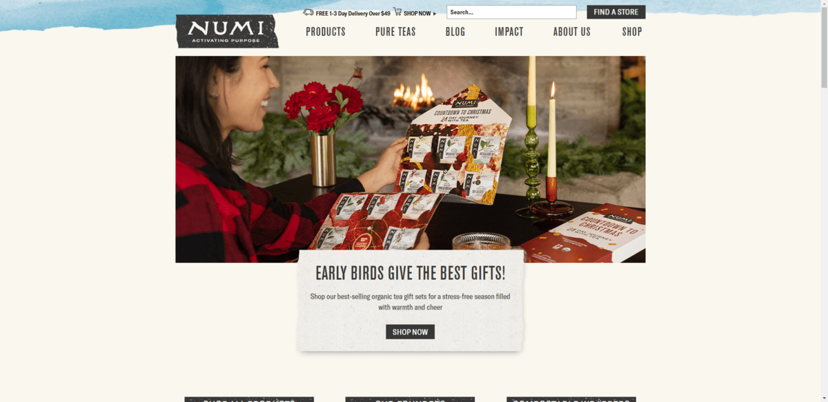 The home page hero image for the Numi website. The background is an off-white, eggshell type of color. There’s a blue strip at the bottom that appears to be hand-brushed. And there are grainy effects applied to some of the content backgrounds (like behind the Numi logo).
