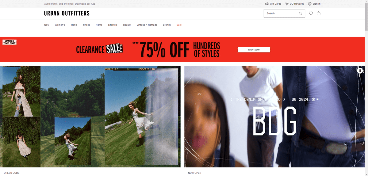 Urban Outfitters sale banner On the Urban Outfitters home page, there is a big red sale notification banner just below the navigation. It reads “Clearance Sale - Up To 75% Off Hundreds of Styles”. There is a white Shop Now button next to the offer.