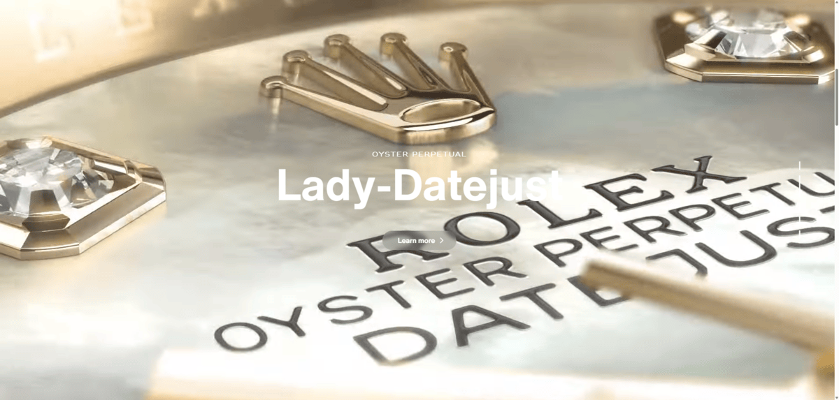 Rolex homepage video On the homepage of the Rolex website, there is a vertical video scroller. In this screenshot, we see a gold Rolex background with the headline “Lady-Datejust” on top of it along with a “Learn more” button.