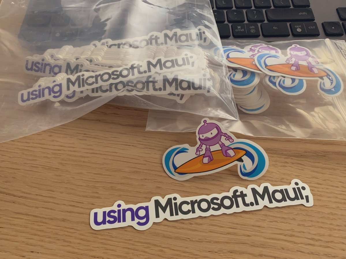 MauiStickers Two Maui Stickers shown in baggies: A logo of the surfer Maui robot, and 'using Microsoft.Maui;'