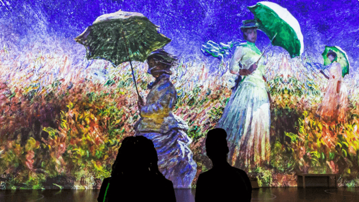 People looking at a painting